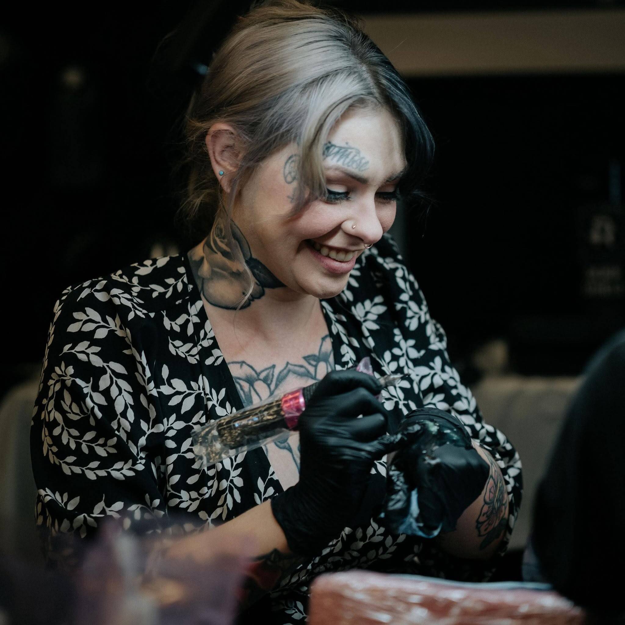 Maddie Sutton at work, tattooing